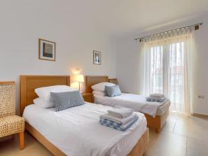 Posteľ alebo postele v izbe v ubytovaní Villa Remington by Interhome
