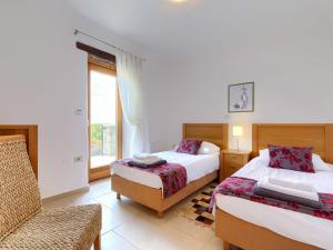 Posteľ alebo postele v izbe v ubytovaní Villa Stuartma by Interhome
