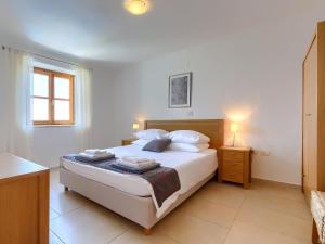 Posteľ alebo postele v izbe v ubytovaní Villa Stuartma by Interhome