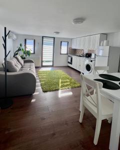 a living room with a couch and a table at Lovely loft in Cluj-Napoca