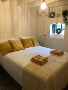 En eller flere senge i et værelse på Gastenverblijf op de Prins Hendrik Hoeve in Buren