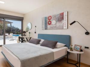 Posteľ alebo postele v izbe v ubytovaní Villa Old Olive VIII by Interhome