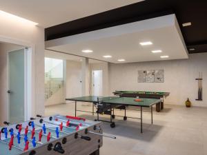 a ping pong room with two ping pong tables at Villa Old Olive I by Interhome in Vodnjan
