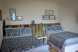 Katil atau katil-katil dalam bilik di Hotel Boutique Ananas