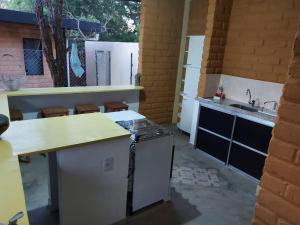 a kitchen with a counter and a sink at Camping Serra Santana in Cavalcante