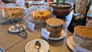 a display of desserts and other food items on a table at Arena Carneiros Hotel by AFT in Tamandaré