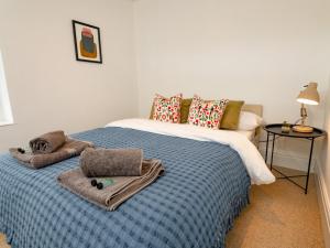 a bedroom with a bed with towels on it at Pass the Keys Perfect for exploring the Wolds Lincoln in Market Rasen