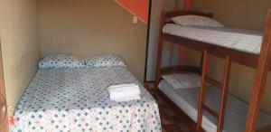 Letto o letti in una camera di Pousada Aconchego