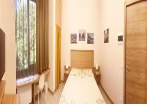 Posteľ alebo postele v izbe v ubytovaní Sissi Comfort Rooms Foresteria Lombarda