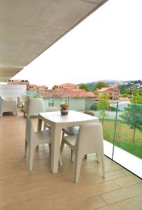 Balkon lub taras w obiekcie GALIHOST - Apartamento con piscina en Canelas, Sanxenxo