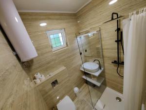 a bathroom with a toilet and a glass shower at Zvončica Deluxe in Vodice +59 photos