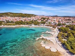 an aerial view of a beach with umbrellas and a city at Zvončica Deluxe in Vodice