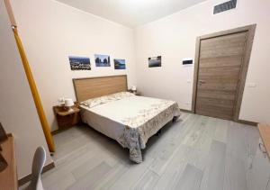 Posteľ alebo postele v izbe v ubytovaní Sissi Comfort Rooms Foresteria Lombarda