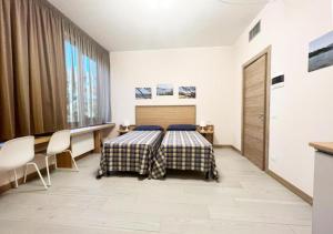 Posteľ alebo postele v izbe v ubytovaní Sissi Comfort Rooms Foresteria Lombarda