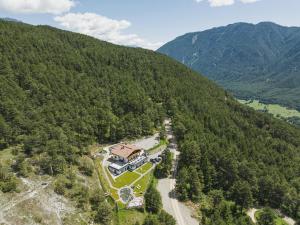 an aerial view of a house in the middle of a mountain at Sinnes Waldrast in Tarrenz