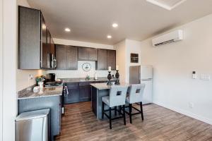 a kitchen with wooden cabinets and a counter top at Hideaway in the Sun in Flagstaff