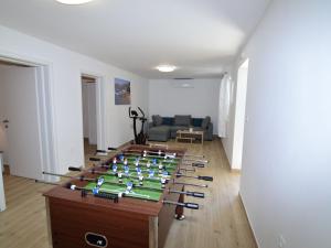 a living room with a table with a chessboard at Holiday Home Kevin by Interhome in Viganj