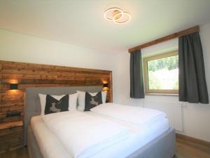 Posteľ alebo postele v izbe v ubytovaní Apartment Geislerhof by Interhome