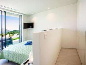 Postel nebo postele na pokoji v ubytování Villa Villa Atina by Interhome