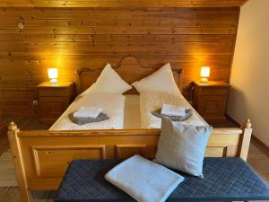 a bedroom with a bed with two pillows on it at Holiday Home Haus Sigfried by Interhome in Bischofshofen