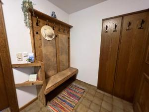 a room with a wooden cabinet and a rug at Holiday Home Haus Sigfried by Interhome in Bischofshofen +54 photos