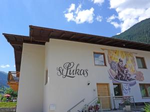 a building with a sign on the side of it at Apartment Gams by Interhome in See