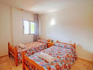 Posteľ alebo postele v izbe v ubytovaní Apartment Voramar-8 by Interhome