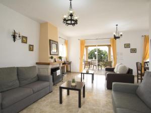 a living room with couches and a fireplace at Villa Acuario by Interhome in Calpe