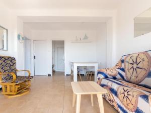 a living room with a couch and a table at Apartment Tabor-1 by Interhome in Torredembarra