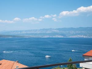 a boat in a large body of water at Holiday Home Villa Vali 2 by Interhome in Vrbnik