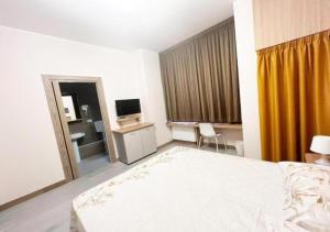 Posteľ alebo postele v izbe v ubytovaní Sissi Comfort Rooms Foresteria Lombarda