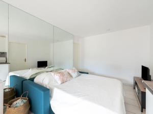 Ένα ή περισσότερα κρεβάτια σε δωμάτιο στο Apartment Turquoise-10 by Interhome