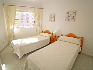 מיטה או מיטות בחדר ב-Apartment Apolo VII-8 by Interhome