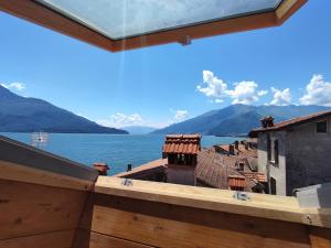 a view of the water from the balcony of a house at Apartment Casa Gemma by Interhome in Domaso