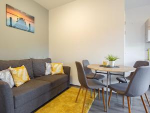 a living room with a couch and a table at Apartment Juventus by Interhome in Balatonföldvár