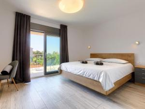 Posteľ alebo postele v izbe v ubytovaní Holiday Home Villa Essea by Interhome