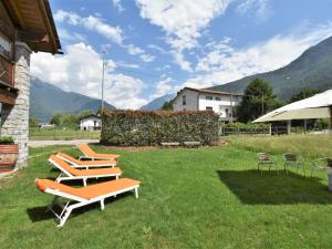 a group of lounge chairs sitting on a lawn at Apartment La Cá Vegia-2 by Interhome in San Cassiano