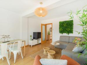 a living room with a couch and a table at Apartment Wave Dream by Interhome in Olhão