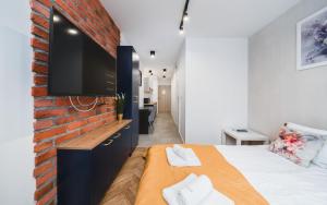 Łóżko lub łóżka w pokoju w obiekcie Ice Apartments