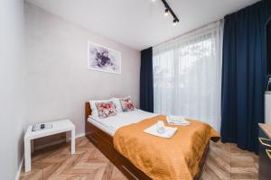 Łóżko lub łóżka w pokoju w obiekcie Ice Apartments