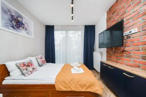 Łóżko lub łóżka w pokoju w obiekcie Ice Apartments