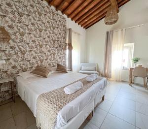 Postel nebo postele na pokoji v ubytování NEW! -Verderame Rooms & Suite in Lucca