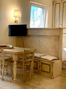 a dining room with a table and a window at Fifty Eight Suite Milan Larga in Milan