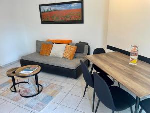 a living room with a couch and a table at Apartment Locarno-Lido in Locarno