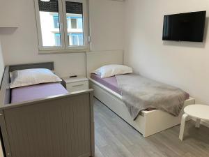 Posteľ alebo postele v izbe v ubytovaní Apartment LJUBICA