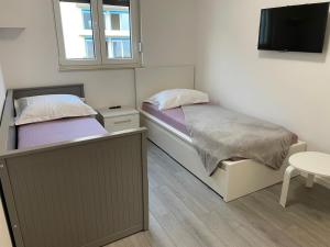 Posteľ alebo postele v izbe v ubytovaní Apartment LJUBICA