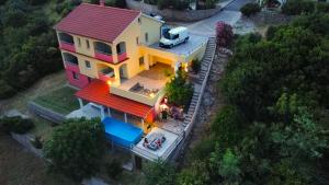 an overhead view of a house with a red roof at Apartments Lumar in Palit
