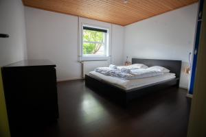 a bedroom with a bed and a window at Lovely 2- bedroom apartment in central Tórshavn in Tórshavn