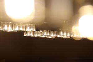 a blurry picture of a city with the sun in the background at Iliani Hotel in Tbilisi City