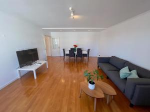 a living room with a couch and a table at Boutique Apartment - 2 Bedroom - Lisbon City Center in Lisbon